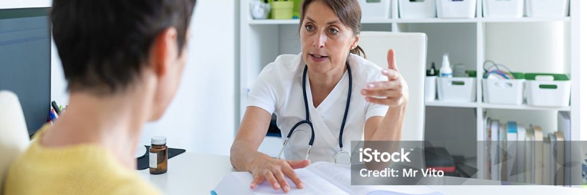 A cardiologist is placing electrodes on an elderly woman's heart in her office to check her heart rate. The heart rate will be measured at home.